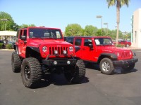 Lifted jeep compared to stock  got 4 x 4